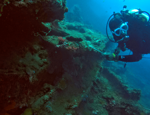 A guy enjoying scuba diving at Tulamben
