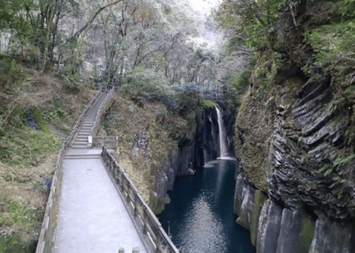 A narrow walking path along the Takachiho Gorge