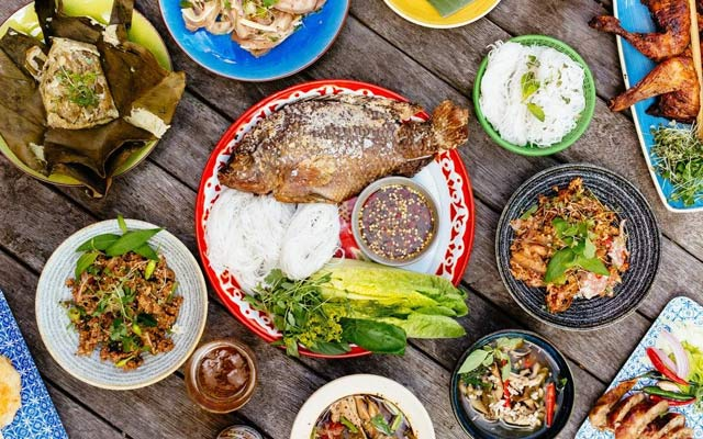 A table full with 15 famous and traditional laotian dishes