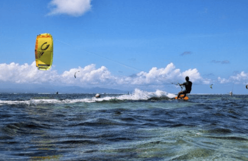A tourist trying kite surfing in Canggu, Bali