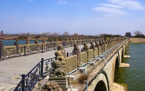 Admiring the intricate stone lions on the Marco Polo Bridge is a must do in Beijing.