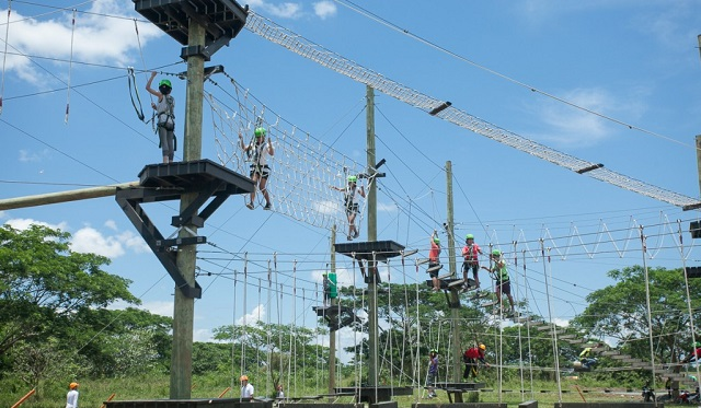 Adventurers navigating the challenging ropes course at Camp N in Nuvali
