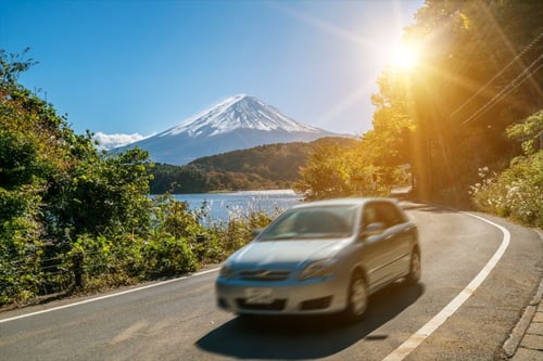 Car driving with Mount Fuji in the background
