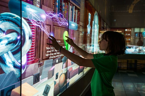 Children interacting with massive digital screens at The Cube, one of the world_s largest digital interactive learning spaces