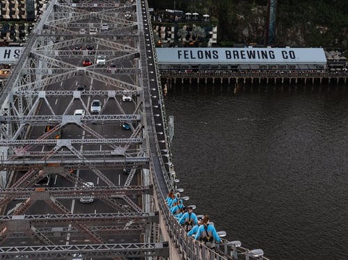 Climbers reaching the summit of Story Bridge