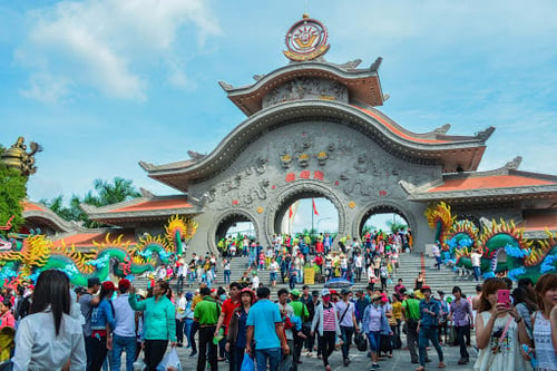 Colourful entrance of Suoi Tien Theme Park, showcasing traditional Vietnamese motifs