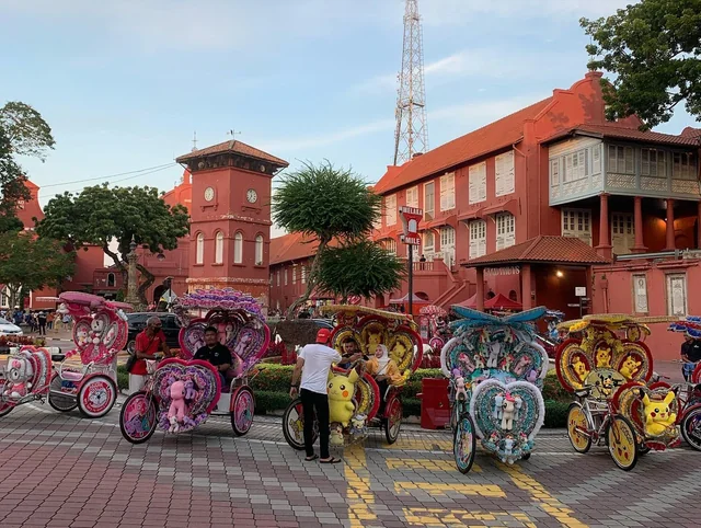 Colourful rickshaws parked at tourist attraction, Dutch Square