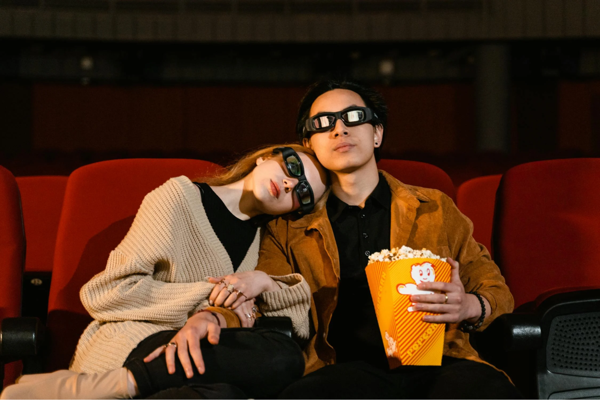 Couple watching a movie together in the cinema