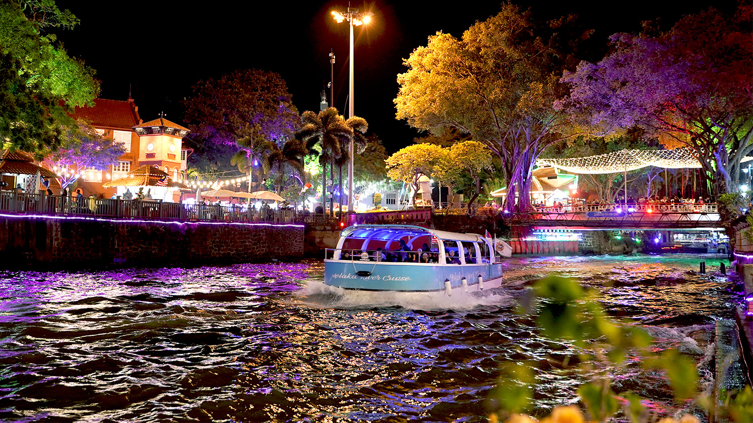 Cruise going down the Malacca River at night, an iconic attraction