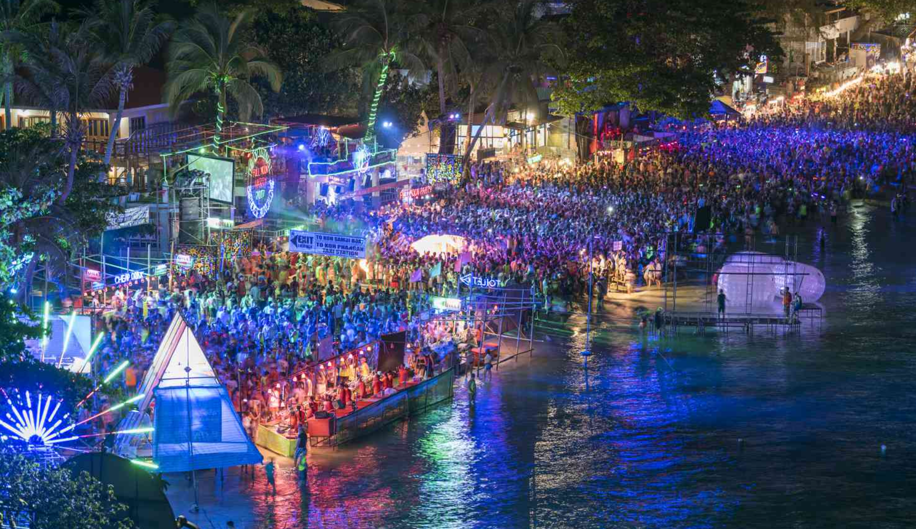 Dance the night away at a full moon party in Thailand, a legendary beach celebration on Koh Phangan.
