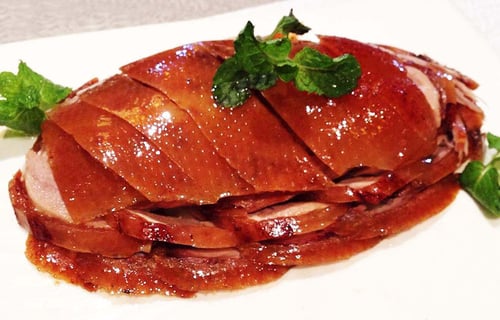 Dining at Siji Minfu Roast Duck Restaurant offers a delightful Beijing cuisine experience.