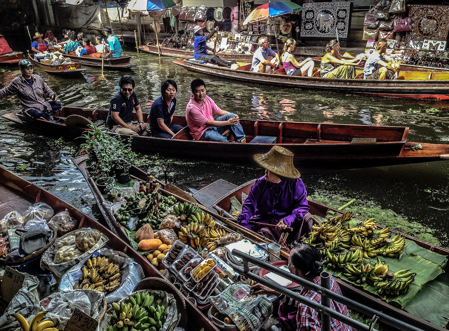 Experience one of the best things in Thailand the bustling floating markets of Bangkok