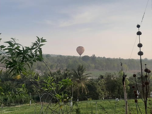 Hot air balloon floating over the scenic landscape of Phan Thiet