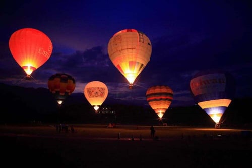 Hot air balloons lifting off at night in Luye Highlands, Taitung