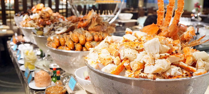 Buffet table filled with fresh seafood at The Mill Grand Millennium Hotel