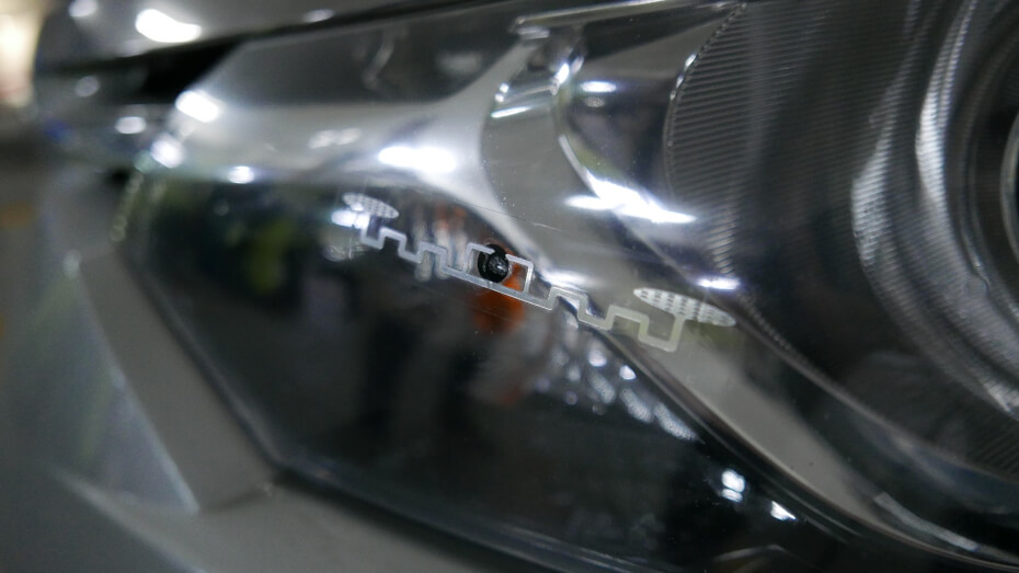 Touch n' Go RFID sticker on car headlamp