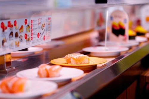 Kura Sushi offers a fun and interactive dining experience with its conveyor belt sushi