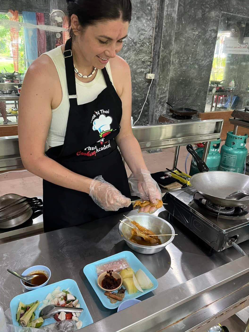 Lady from a couple trying this unique experience in Phuket cooking class