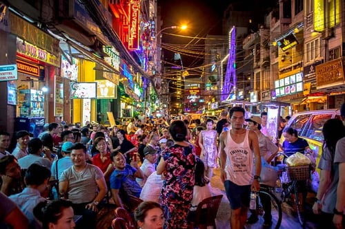 Lively night scene at Bui Vien Street with crowds enjoying the vibrant nightlife