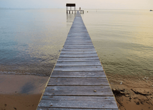 Picturesque old jetty in Phu Quoc, a charming spot for a leisurely stroll and taking in the views of the fishing boats and the sea. 1