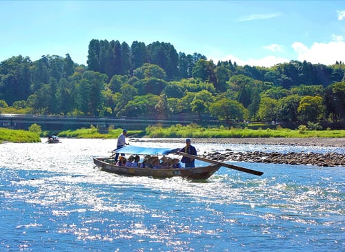 Rafting on the Kuma River offers an exhilarating way to enjoy the surroundings