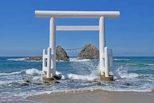 The Sakurai Futamigaura Couple Stones are a pair of large rocks connected by a sacred Shinto rope