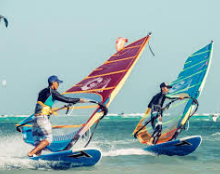 Tourists doing windsurfing, one of the unique things to do in Boracay