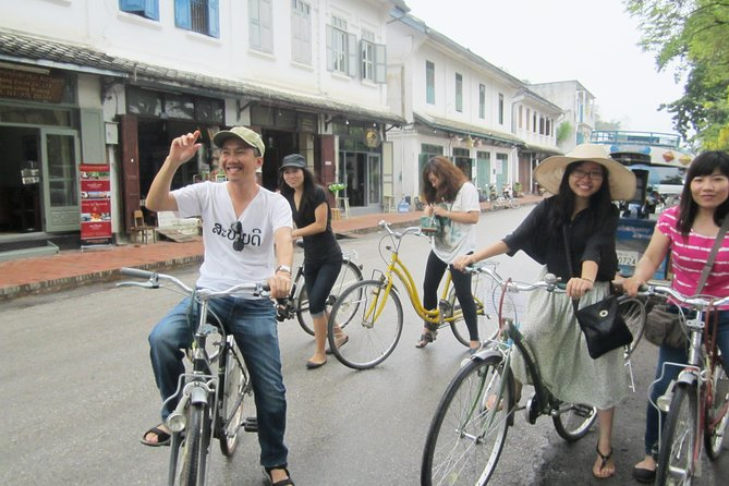 Tourists on a biking tour in Luang Prabang city