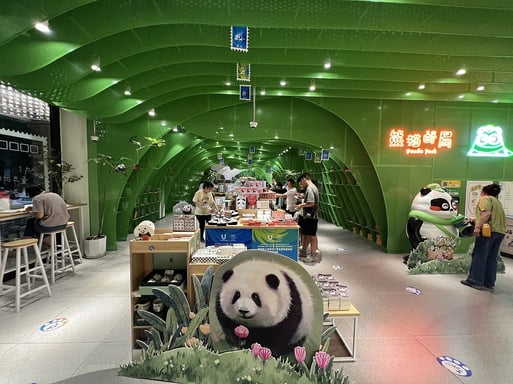 Tourists posting letters at Chengdu Panda Post, a unique Chengdu City attraction featuring panda-themed postcards.