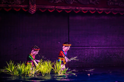 Traditional Vietnamese water puppet show performance depicting rural life scenes