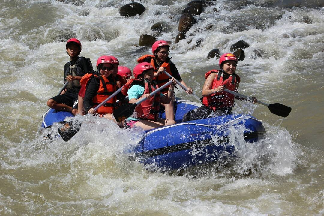 Travellers rafting down the Kiulu River, a must-do in Sabah for thrill seekers