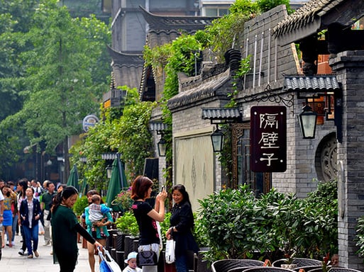 Visitors exploring the traditional architecture of Kuanzhai Alley, a must-see in Chengdu city attractions.