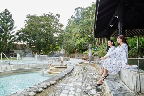 Visitors sitting by the pools at the Jhihben Hot Spring in Taitung, Taiwan