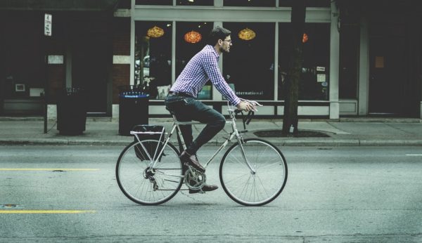 Discover Your Money Personality: The Minimalist - man riding a bicycle