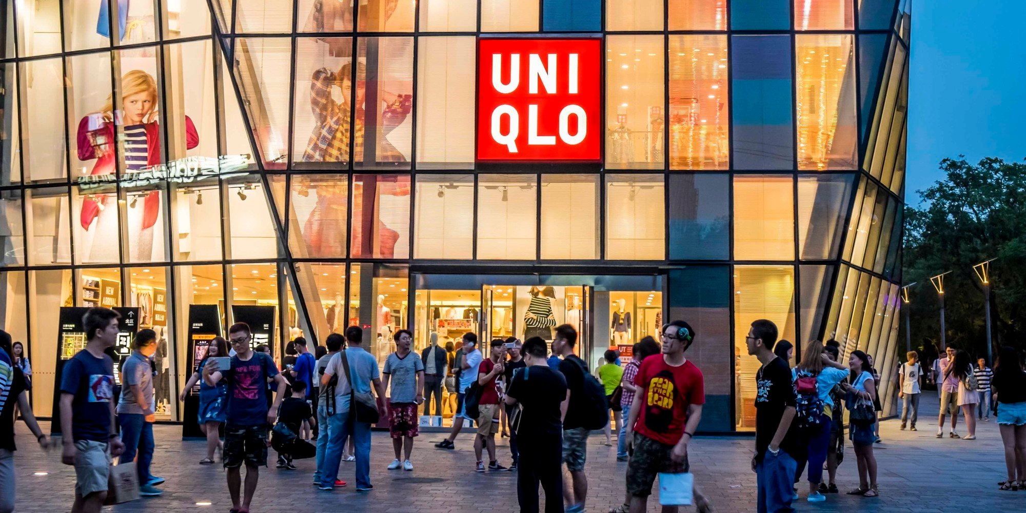 BEIJING, CHINA - JULY 15: (CHINA OUT) People walk by a Uniqlo outlet at Sanlitun after a sex video taken in what appears to be a Uniqlo store fitting room spread online on July 15, 2015 in Beijing, China. The video shot by a smartphone showed a young couple having sex in what appears to be a Uniqlo store fitting room. The Cyberspace Administration of China urged Sina and Tencent to increase their awareness of social responsibility, strengthen management and cooperate with the authority in investigating the case. (Photo by ChinaFotoPress/ChinaFotoPress via Getty Images)