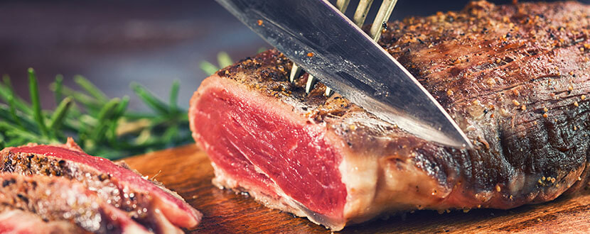 Cutting a ribeye steak -SingSaver