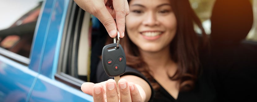 lady getting her new set of car keys -SingSaver