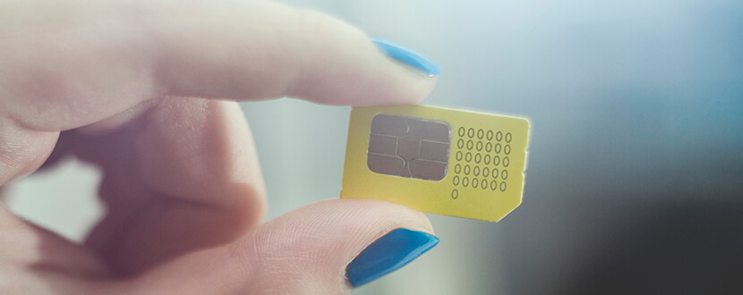 Person holding a sim card - SingSaver