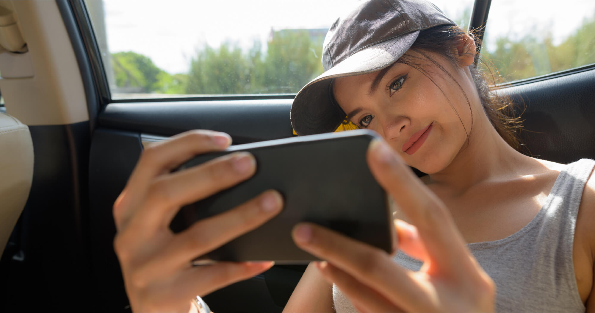 person stuck on her phone while travelling