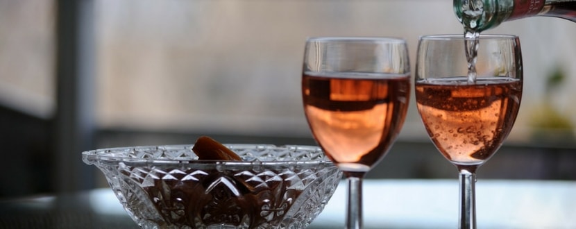 pouring pink wine in glasses