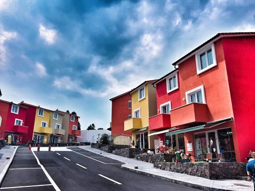 brightly coloured houses in swiss village, jeju, on a cloudy day
