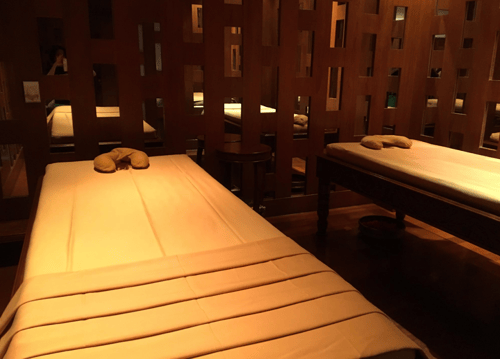 spa treatment room with massage beds for couples relaxation activity