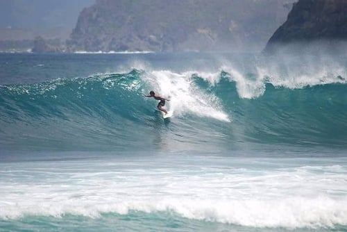 surfing, one of the things to do in lombok