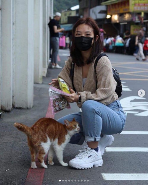 tourist doing unusual things to do in taipei houtong cat village