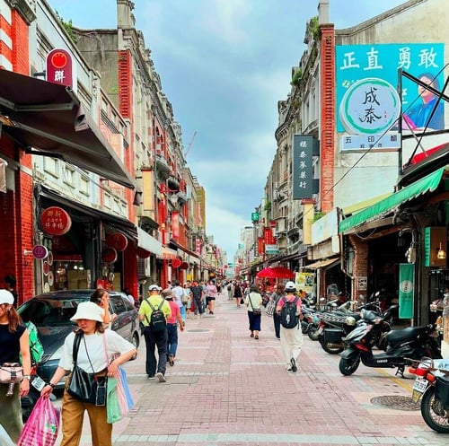 tourists doing cultural things to do in taipei dihua street