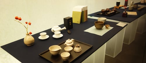 viewing traditional tea sets and utensils as part of a jeju itinerary