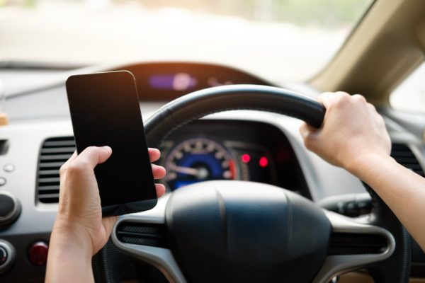 8 Possible Reasons Your Car Insurance Claim Got Denied - texting while driving