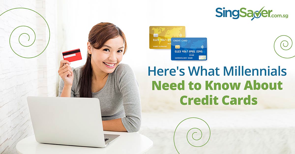 happy girl holding credit card in hand with laptop - SingSaver